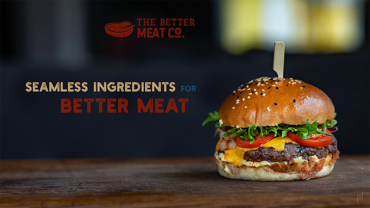The Better Meat Co. – Title slide featuring SEAMLESS INGREDIENTS FOR BETTER MEAT over a dark background with a photo of a delicious hamburger, symbolizing sustainable food innovation.